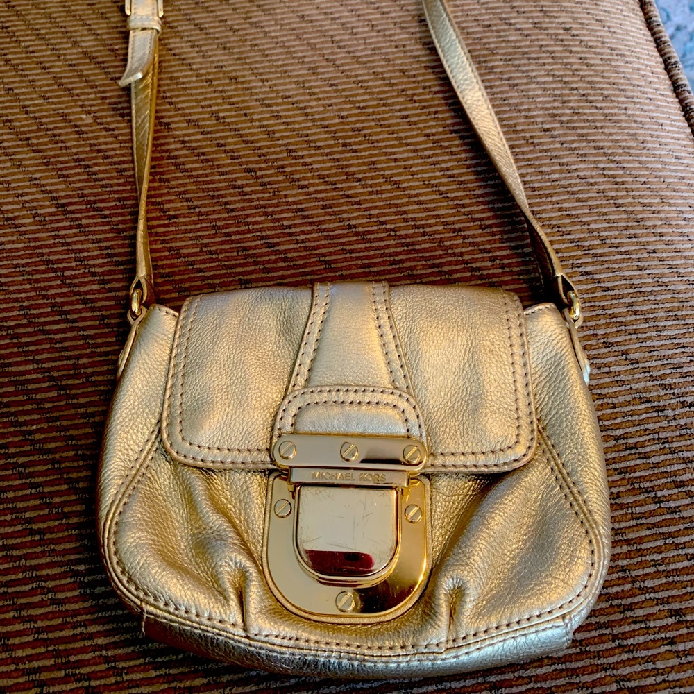 Michael Kors gold crossbody bag.